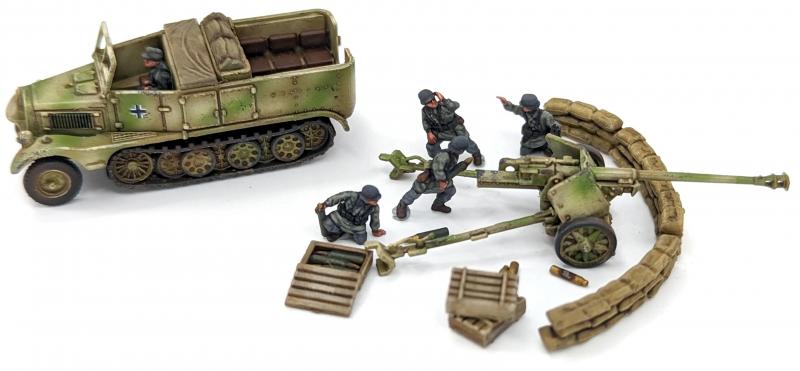 7.5cm Pak 40 and Sdkfz 11’s--four each of 1:144 scale halftracks and cannon (unpainted plastic kit) #5