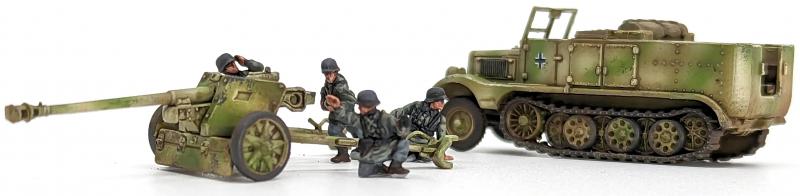 7.5cm Pak 40 and Sdkfz 11’s--four each of 1:144 scale halftracks and cannon (unpainted plastic kit) #7