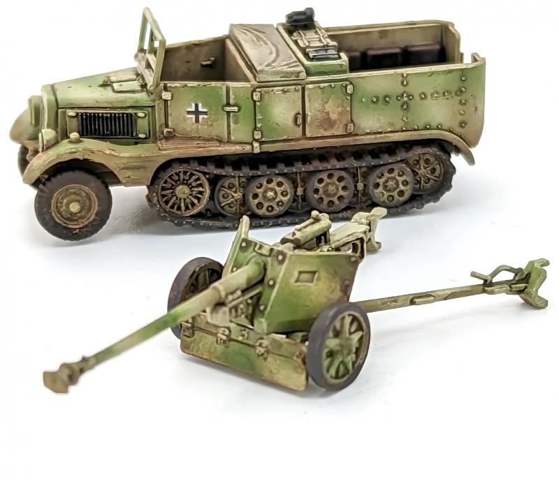 7.5cm Pak 40 and Sdkfz 11’s--four each of 1:144 scale halftracks and cannon (unpainted plastic kit) #8