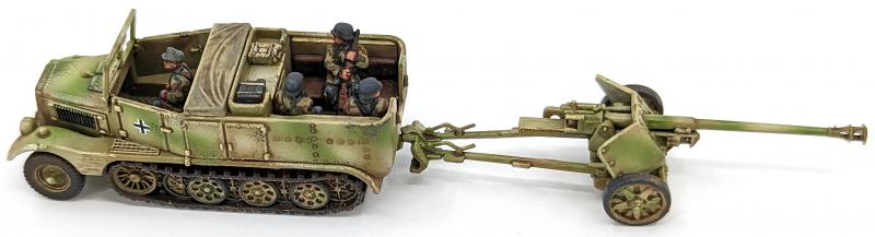 7.5cm Pak 40 and Sdkfz 11’s--four each of 1:144 scale halftracks and cannon (unpainted plastic kit) #19