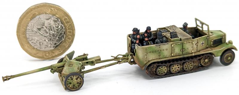 7.5cm Pak 40 and Sdkfz 11’s--four each of 1:144 scale halftracks and cannon (unpainted plastic kit) #21