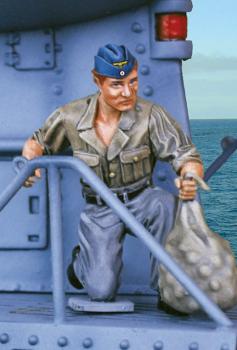 Image of UBoat Supply Crew One--single kneeling figure holding bag