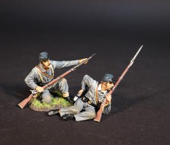 Image of Two Infantrymen (blue hats, grey uniforms), 4th Virginia Regiment, First Brigade, The Army of the Shenandoah, The First Battle of Manassas, 1861, ACW 1861-1865--two figures (kneeling loading, leaning on left elbow and reaching for cartridge)