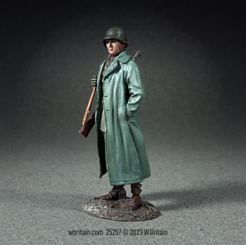 Image of U.S. Infantryman Standing with Raincoat over Equipment--single figure