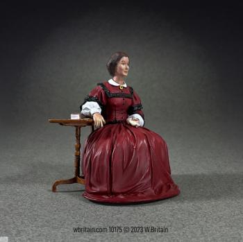 Image of Clara Barton, American Civil War Nurse and Founder of the American Red Cross--single seated figure with side table