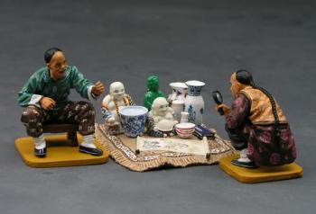 Chinese Curio Seller--two crouching figures and curios #0