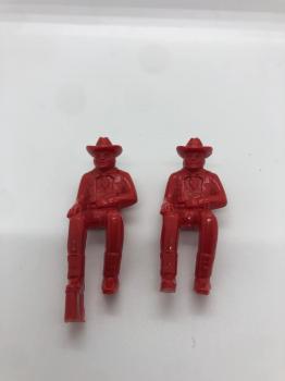 Image of Seated Cowboys in red--two figures