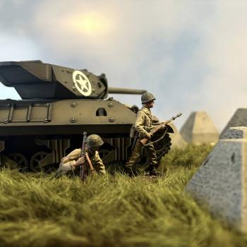 Two infantry next to tank